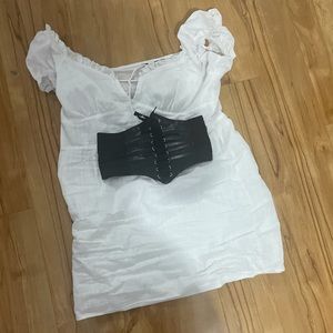 A white dress with a black corset